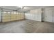 Attached two-car garage with storage cabinets at 10048 E Emerald Dr, Sun Lakes, AZ 85248