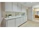 Hallway with built-in storage and neutral decor at 10048 E Emerald Dr, Sun Lakes, AZ 85248