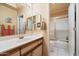 Guest bathroom with single vanity and shower/tub combo at 10605 E Nacoma Dr, Sun Lakes, AZ 85248