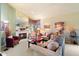 Bright living room featuring a fireplace and large mirror at 10605 E Nacoma Dr, Sun Lakes, AZ 85248