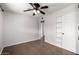 Spacious bedroom with ceiling fan and built-in shelving at 1061 W 5Th St, Mesa, AZ 85201