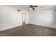 Well-lit bedroom with neutral carpeting and ceiling fan at 1061 W 5Th St, Mesa, AZ 85201