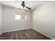 Spacious bedroom with carpet and ceiling fan at 1061 W 5Th St, Mesa, AZ 85201