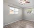 Bedroom with wood-look flooring and ceiling fan at 1061 W 5Th St, Mesa, AZ 85201