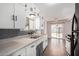 Updated kitchen features white cabinets and gray backsplash at 1061 W 5Th St, Mesa, AZ 85201