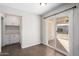 Laundry area with built-in cabinets and sliding door at 1061 W 5Th St, Mesa, AZ 85201