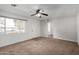 Spacious living room featuring neutral carpeting and ample natural light at 1061 W 5Th St, Mesa, AZ 85201