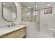 Modern bathroom with a frameless glass shower and marble vanity at 10639 E Fernwood Ln, Scottsdale, AZ 85262