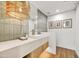 Elegant powder room with a unique light fixture and modern sink at 10639 E Fernwood Ln, Scottsdale, AZ 85262