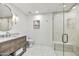 Clean bathroom with marble vanity and a glass-enclosed shower at 10639 E Fernwood Ln, Scottsdale, AZ 85262