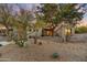 Contemporary home with stone accents and drought-tolerant landscaping at 10639 E Fernwood Ln, Scottsdale, AZ 85262