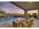 Inviting backyard oasis with a pool, spa, and fire pit at 10639 E Fernwood Ln, Scottsdale, AZ 85262