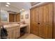 Bathroom with double sink vanity and wood cabinets at 26325 N 107Th Way, Scottsdale, AZ 85255