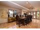 Elegant dining room with large table and access to patio at 26325 N 107Th Way, Scottsdale, AZ 85255