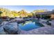 Relaxing pool area with a spacious patio and desert landscaping at 26325 N 107Th Way, Scottsdale, AZ 85255