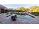 Large rectangular pool with tiled patio and potted plants at 26325 N 107Th Way, Scottsdale, AZ 85255