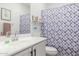 Bathroom with shower/tub combo and patterned curtain at 1094 S 151St S Ln, Goodyear, AZ 85338