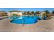 Community pool featuring a splash pad area and safety handrails for easy access at 1094 S 151St S Ln, Goodyear, AZ 85338