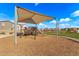 Modern playground equipment under a shaded structure at 1094 S 151St S Ln, Goodyear, AZ 85338