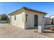 Community pool house with a tile roof, exterior lighting, and desert landscaping at 1094 S 151St S Ln, Goodyear, AZ 85338