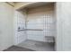 Outdoor shower area includes white subway tile, handheld shower head, and fold down seat at 1094 S 151St S Ln, Goodyear, AZ 85338