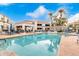 Sparkling community pool with plenty of lounge chairs at 11375 E Sahuaro Dr # 2066, Scottsdale, AZ 85259