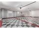 Large garage with ample storage and checkerboard floor at 11510 E Mirasol Cir, Scottsdale, AZ 85255