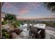 Outdoor kitchen and pool area with mountain views at 11510 E Mirasol Cir, Scottsdale, AZ 85255