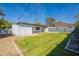 Serene backyard with a lush lawn, privacy fence, and mountain views, perfect for outdoor relaxation at 1219 E Seldon Ln, Phoenix, AZ 85020