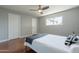 This bedroom has a contemporary ceiling fan, and a large window providing natural light and views at 1219 E Seldon Ln, Phoenix, AZ 85020