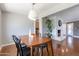 Cozy dining area with view of living room and modern lighting fixture at 1219 E Seldon Ln, Phoenix, AZ 85020