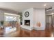 Open-concept living room featuring a fireplace and dining area at 1219 E Seldon Ln, Phoenix, AZ 85020