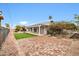 Brick patio and putting green in the backyard at 12451 N Cherry Hills E Dr, Sun City, AZ 85351