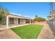 Artificial turf and covered patio in the backyard at 12451 N Cherry Hills E Dr, Sun City, AZ 85351