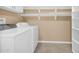 Laundry room with washer, dryer, and shelving at 12451 N Cherry Hills E Dr, Sun City, AZ 85351