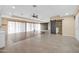 Open living area with tile flooring and a barn door at 12451 N Cherry Hills E Dr, Sun City, AZ 85351