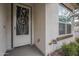 White front door with screen door and small plants at 1255 N Arizona Ave # 1109, Chandler, AZ 85225