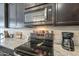 Stainless steel appliances and granite countertops in kitchen at 1255 N Arizona Ave # 1109, Chandler, AZ 85225