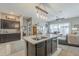 Kitchen island with double sink and view into living room at 1255 N Arizona Ave # 1109, Chandler, AZ 85225