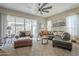 Living room with sectional sofa, armchair, and wood coffee table at 1255 N Arizona Ave # 1109, Chandler, AZ 85225