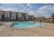 Community pool with multiple lounge chairs at 1255 N Arizona Ave # 1109, Chandler, AZ 85225