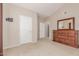 Well-lit bedroom with ample closet space and dresser at 14250 W Wigwam Blvd # 2121, Litchfield Park, AZ 85340