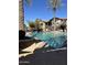 Inviting community pool with a spa and palm trees at 14250 W Wigwam Blvd # 2121, Litchfield Park, AZ 85340