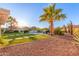 Landscaped backyard with a pathway leading to the pool at 14316 W Circle Ridge Dr, Sun City West, AZ 85375