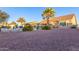 Large backyard with gravel, mature plants and a covered patio at 14316 W Circle Ridge Dr, Sun City West, AZ 85375