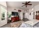 Spacious bedroom with large window and ceiling fan at 14316 W Circle Ridge Dr, Sun City West, AZ 85375