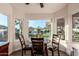 Breakfast nook with a table and chairs, overlooking the backyard at 14316 W Circle Ridge Dr, Sun City West, AZ 85375