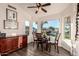 Bright breakfast nook with view of the pool and backyard at 14316 W Circle Ridge Dr, Sun City West, AZ 85375