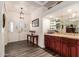 Bright entryway with hardwood floors, built-in bar, and decorative console table at 14316 W Circle Ridge Dr, Sun City West, AZ 85375