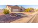 Front view of a single story home with gravel driveway and landscaping at 14316 W Circle Ridge Dr, Sun City West, AZ 85375